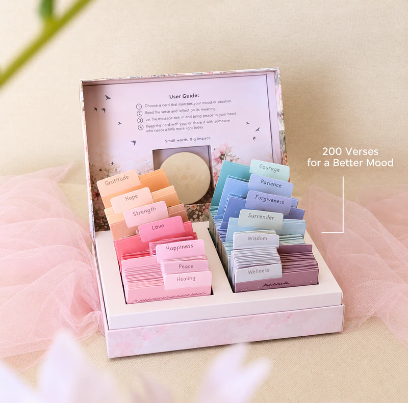 An open Lumee box with colourful Qur’an reflection cards organised by theme.
